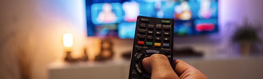 pointing a remote at the TV