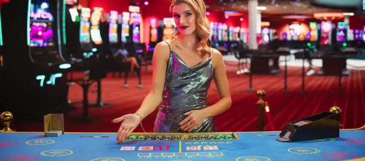 casino dealer presenting a baccarat board